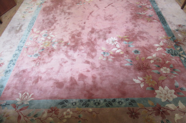 A CHINESE WASHED AND FRINGED RUG Image