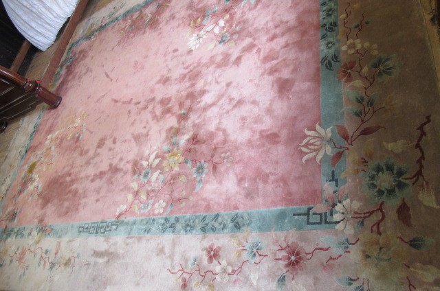 A CHINESE WASHED AND FRINGED RUG Image