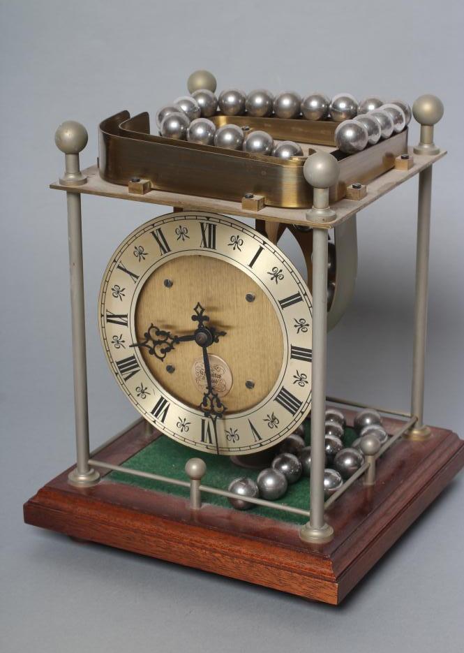 A THWAITES REED ROLLING BALL CLOCK Image