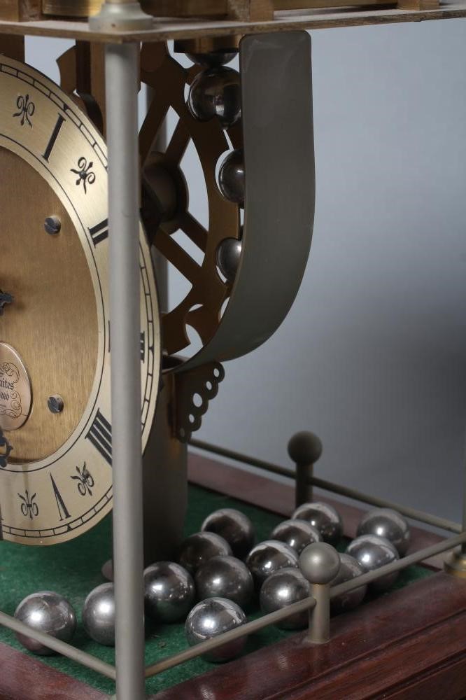 A THWAITES REED ROLLING BALL CLOCK Image