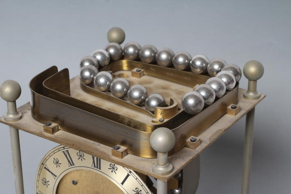 A THWAITES REED ROLLING BALL CLOCK Image