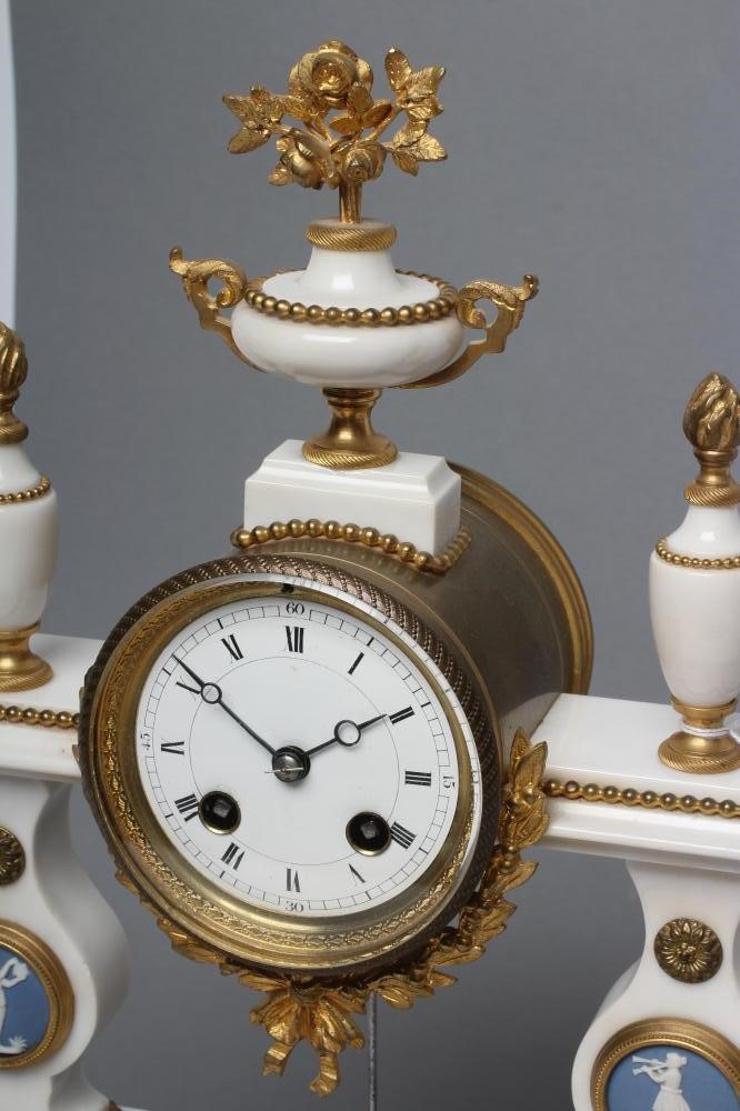 A FRENCH WHITE MARBLE AND GILT METAL PORTICO CLOCK Image
