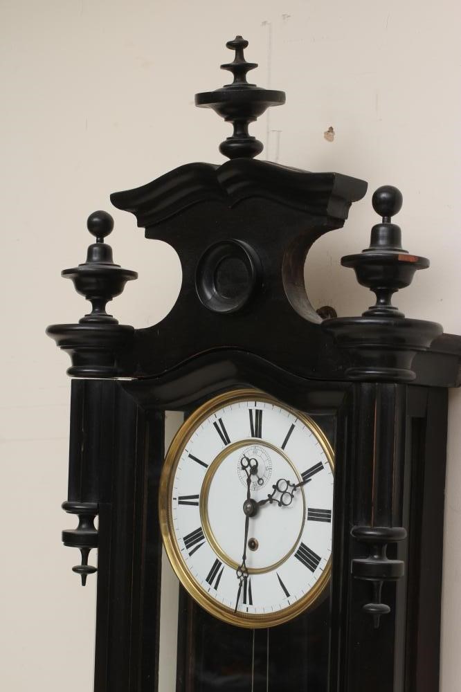 AN EBONISED CASED VIENNA WALL CLOCK Image