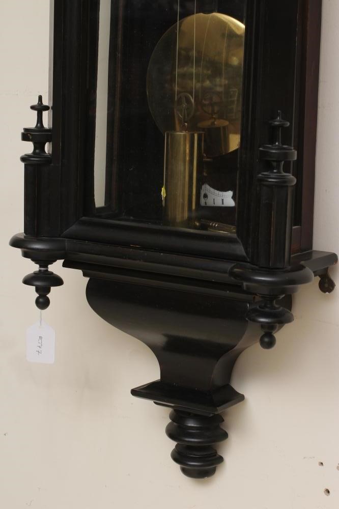 AN EBONISED CASED VIENNA WALL CLOCK Image