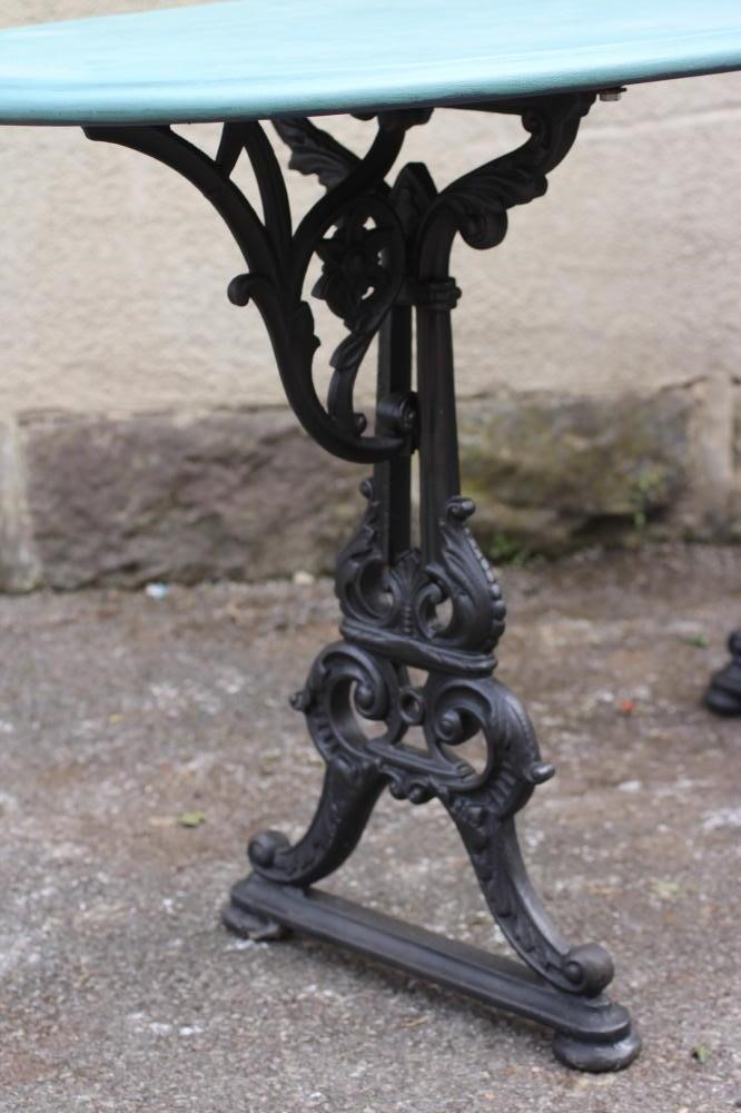 A CAST IRON GARDEN TABLE Image