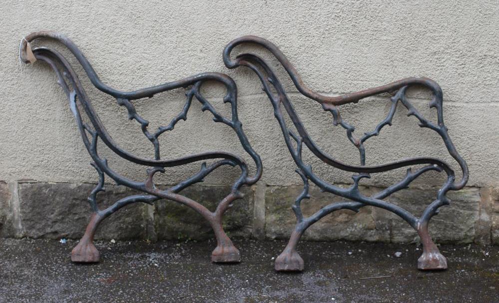 A PAIR OF VICTORIAN CAST IRON PARK BENCH ENDS of truncated branch form Image