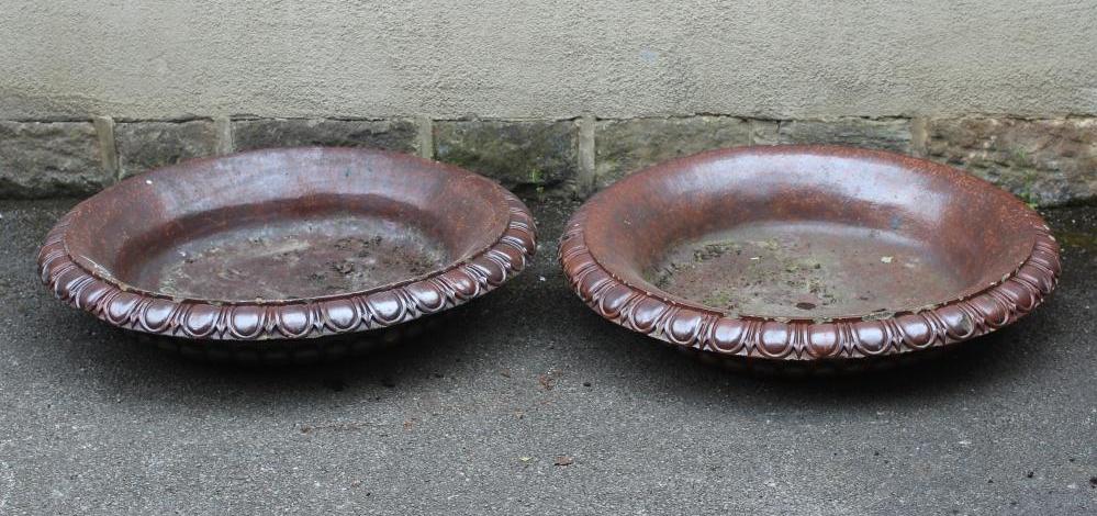 A PAIR OF LARGE SALT GLAZED POTTERY FOUNTAIN TRAYS of shallow circular form with egg and dart Image