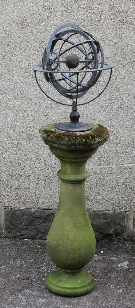 A BRONZED METAL ARMILLARY SPHERE on turned baluster stem and circular base Image