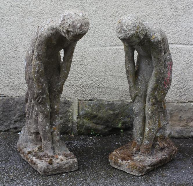 A PAIR OF COMPOSITION STONE POND SIDE FIGURES modelled as young nude girls leaning forward Image