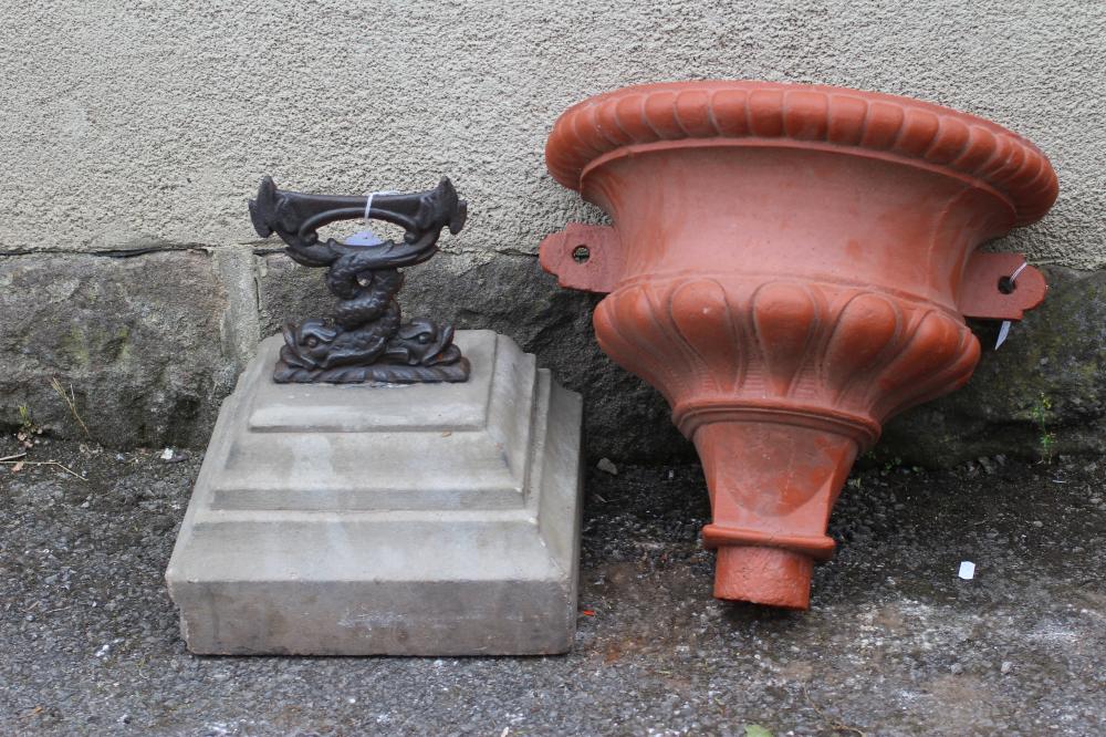 A CAST IRON BOOT SCRAPER modelled as two entwined dolphins Image