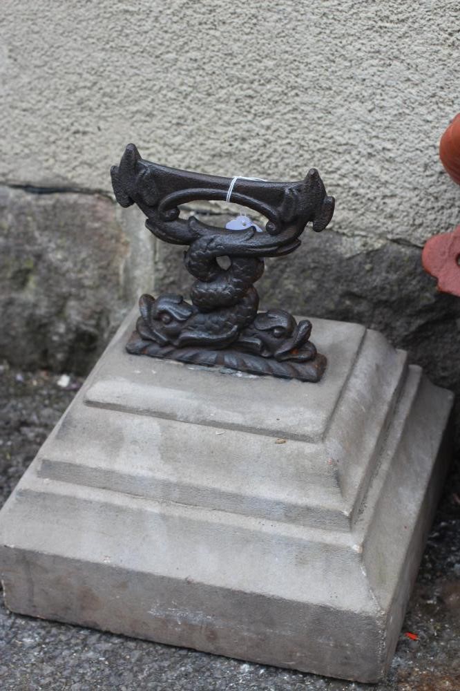 A CAST IRON BOOT SCRAPER modelled as two entwined dolphins Image