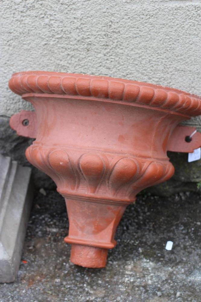 A CAST IRON BOOT SCRAPER modelled as two entwined dolphins Image