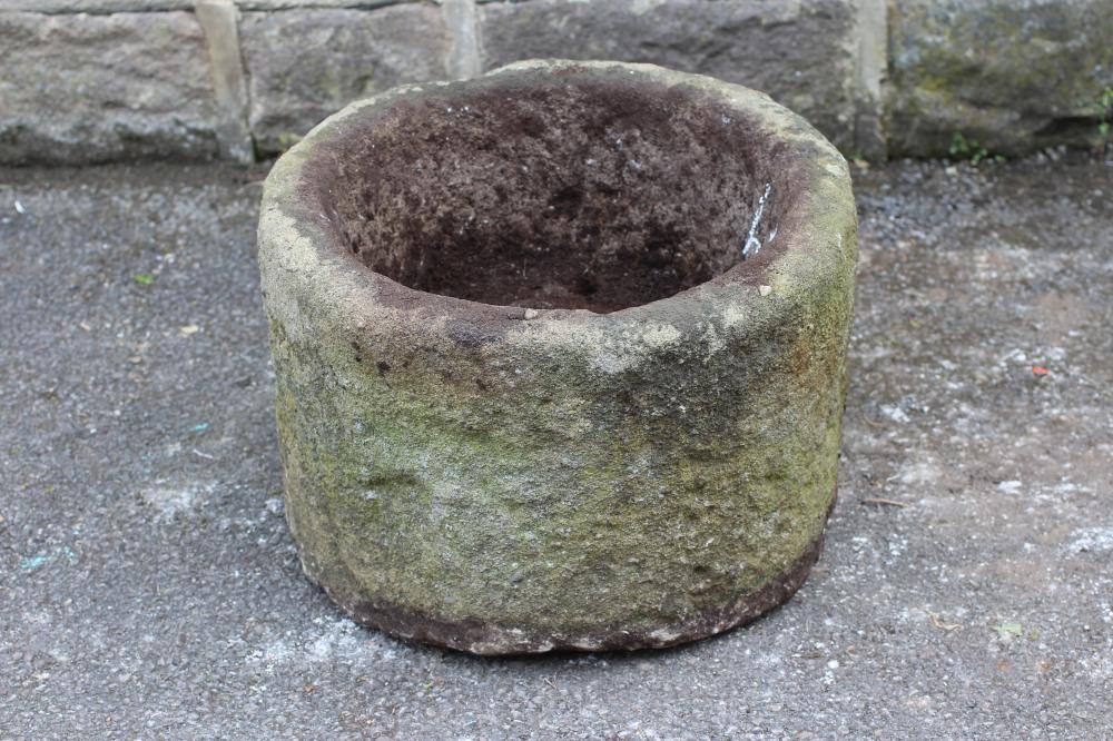 A GRITSTONE TROUGH of circular form Image