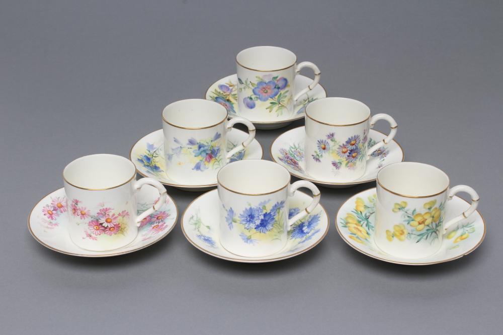 A SET OF FOUR ROYAL WORCESTER CHINA COFFEE CANS AND SAUCERS Image