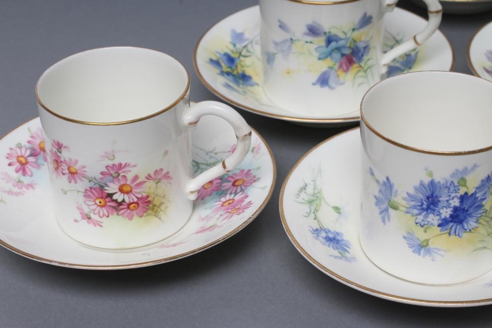 A SET OF FOUR ROYAL WORCESTER CHINA COFFEE CANS AND SAUCERS Image
