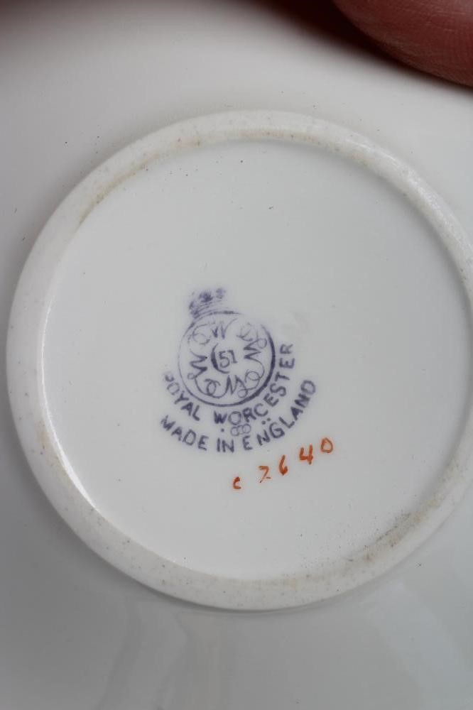 A SET OF FOUR ROYAL WORCESTER CHINA COFFEE CANS AND SAUCERS Image