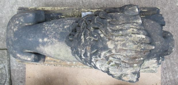 A PAIR OF CARVED STONE RECUMBENT LIONS Image