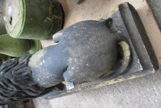 A PAIR OF CARVED STONE RECUMBENT LIONS Image