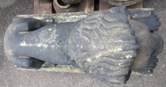A PAIR OF CARVED STONE RECUMBENT LIONS Image