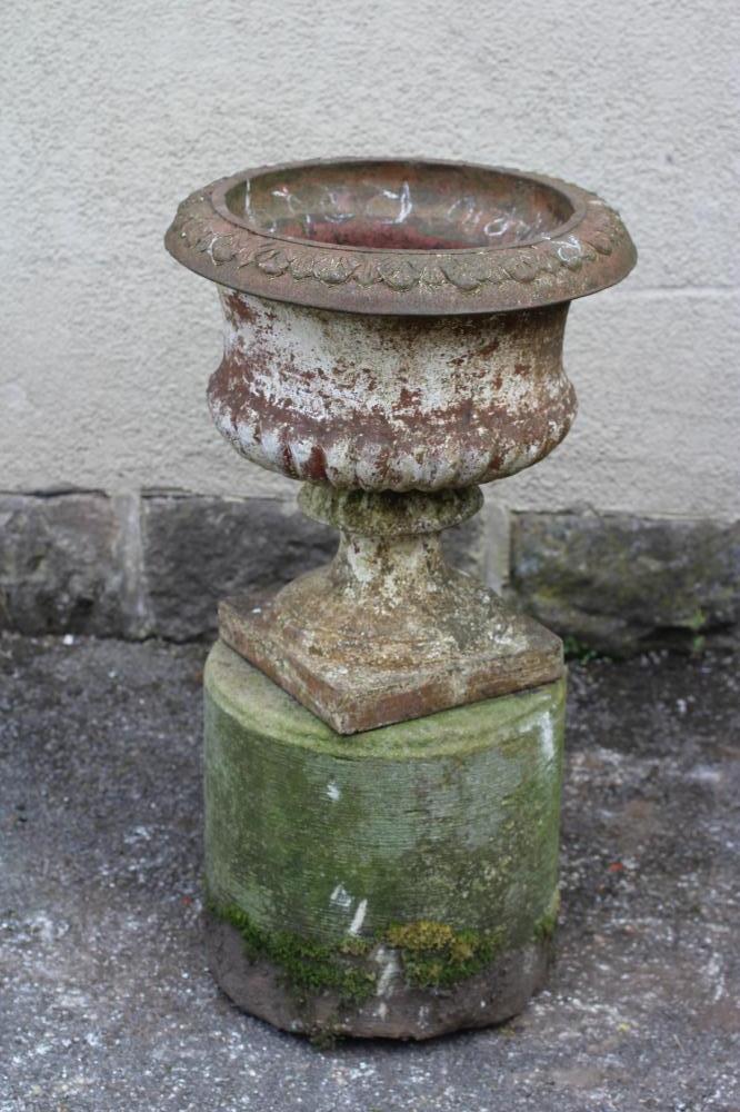 A VICTORIAN TERRACOTTA GARDEN URN of half fluted campana form with leaf moulded rim Image