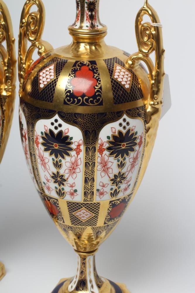 A PAIR OF ROYAL CROWN DERBY CHINA IMARI PATTERN URNS Image