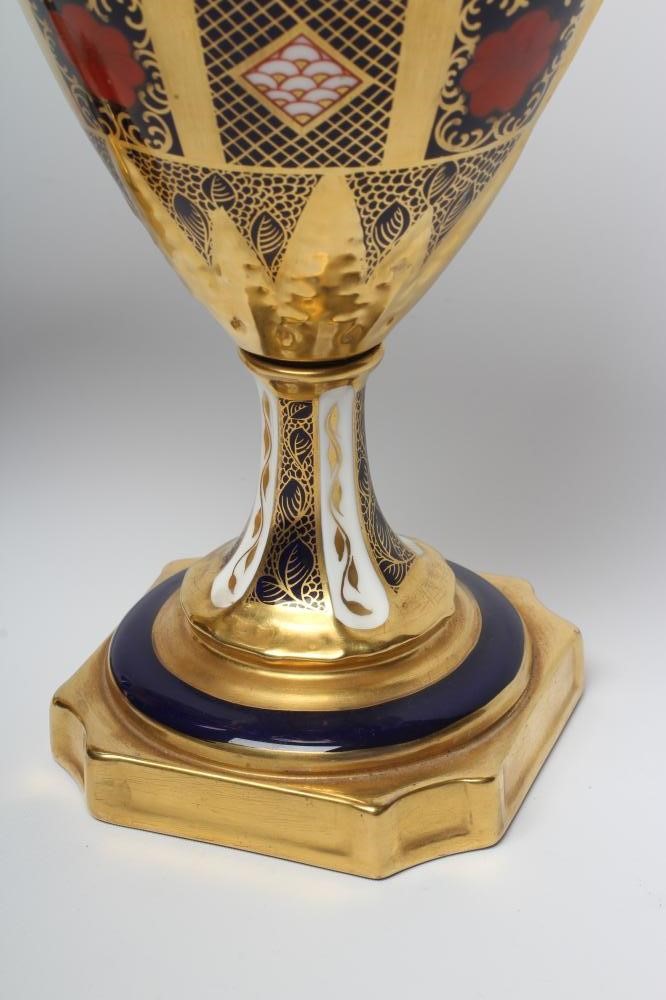 A PAIR OF ROYAL CROWN DERBY CHINA IMARI PATTERN URNS Image