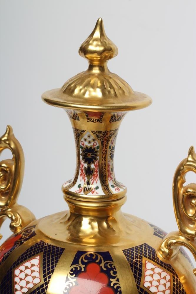 A PAIR OF ROYAL CROWN DERBY CHINA IMARI PATTERN URNS Image
