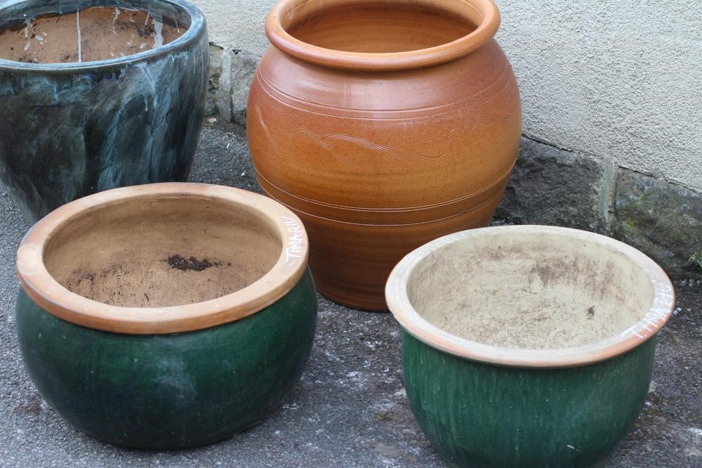A LARGE STONEWARE PLANT POT of oval form with incised line banding Image