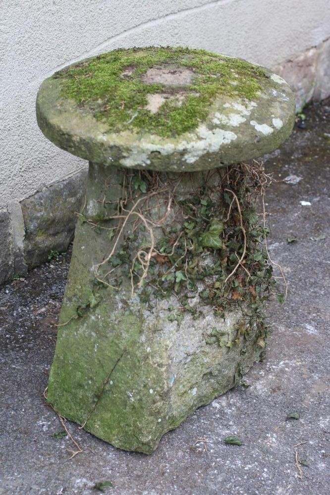 A SANDSTONE STADDLE STONE similar to previous lot Image