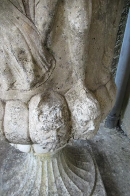 A PAIR OF MEDICI PATTERN COMPOSITION STONE URNS with flared egg and dart rim over a frieze of Image