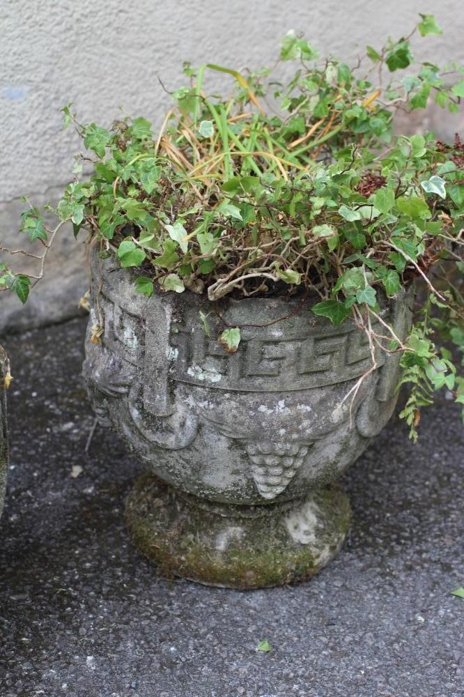 A PAIR OF COMPOSITION STONE URN PLANTERS of circular form with key banded rim Image