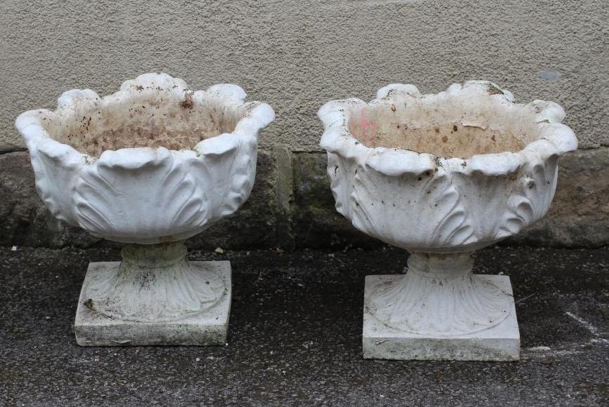 A PAIR OF COMPOSITION STONE URNS Image