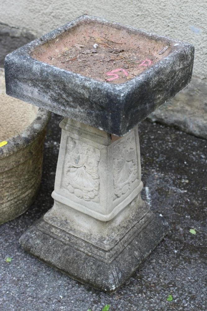 A COMPOSITION STONE BIRD BATH of square form with tapering stem Image