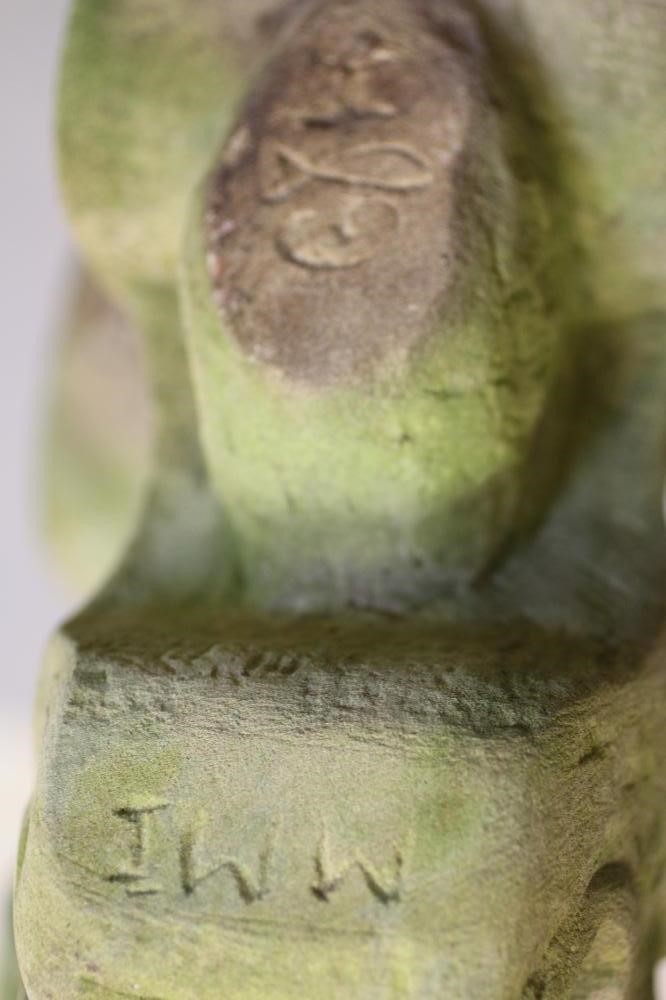 A PAIR OF CARVED SANDSTONE LION GARGOYLES on square bases Image