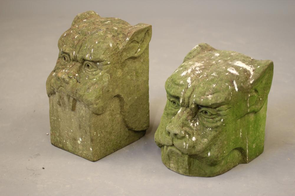 A PAIR OF CARVED STONE DOG HEAD FINIALS on square bases Image