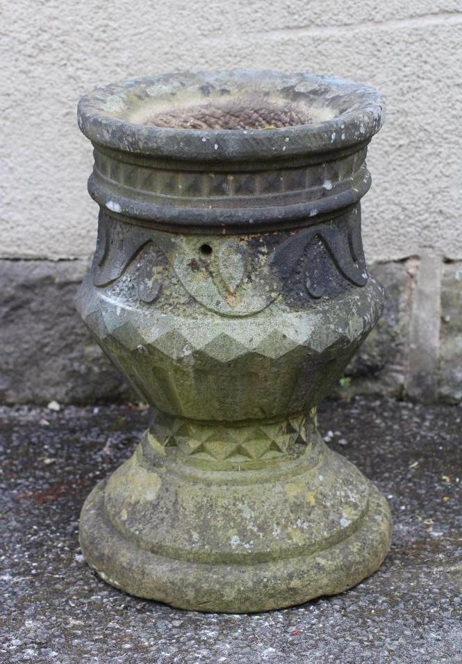 A CARVED SANDSTONE PLANTER of urn form with geometric and stylised leaf banding Image