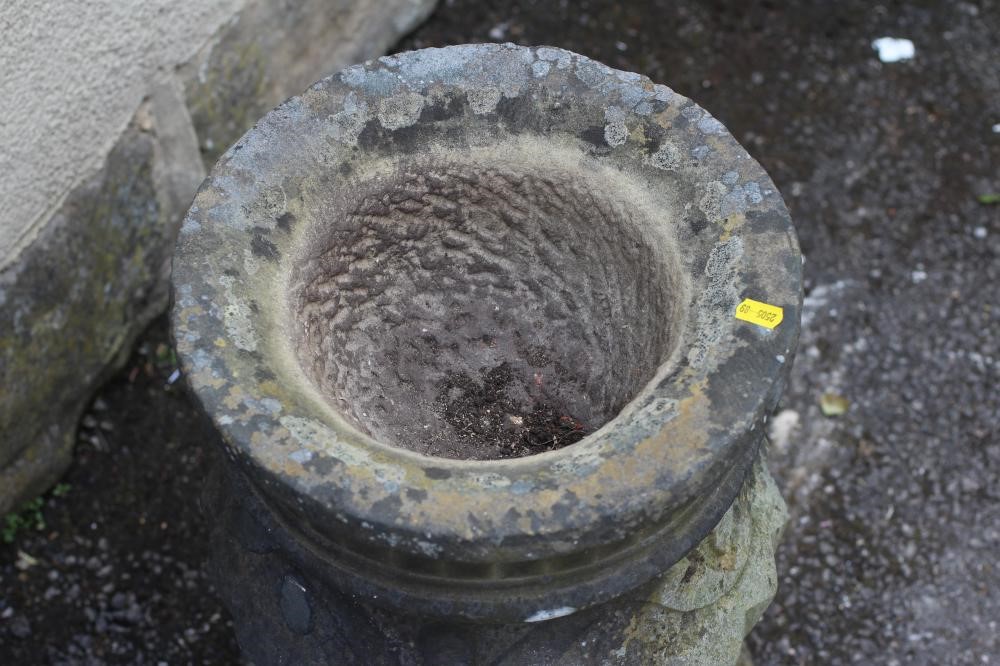 A CARVED SANDSTONE PLANTER of urn form with geometric and stylised leaf banding Image