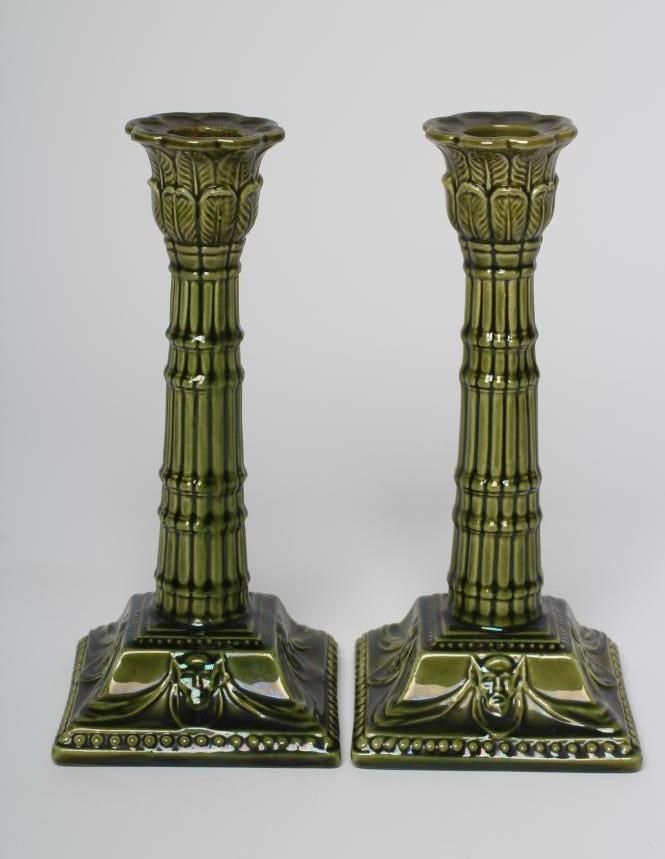 A PAIR OF BURMANTOFTS FAIENCE GREEN GLAZED CANDLESTICKS Image