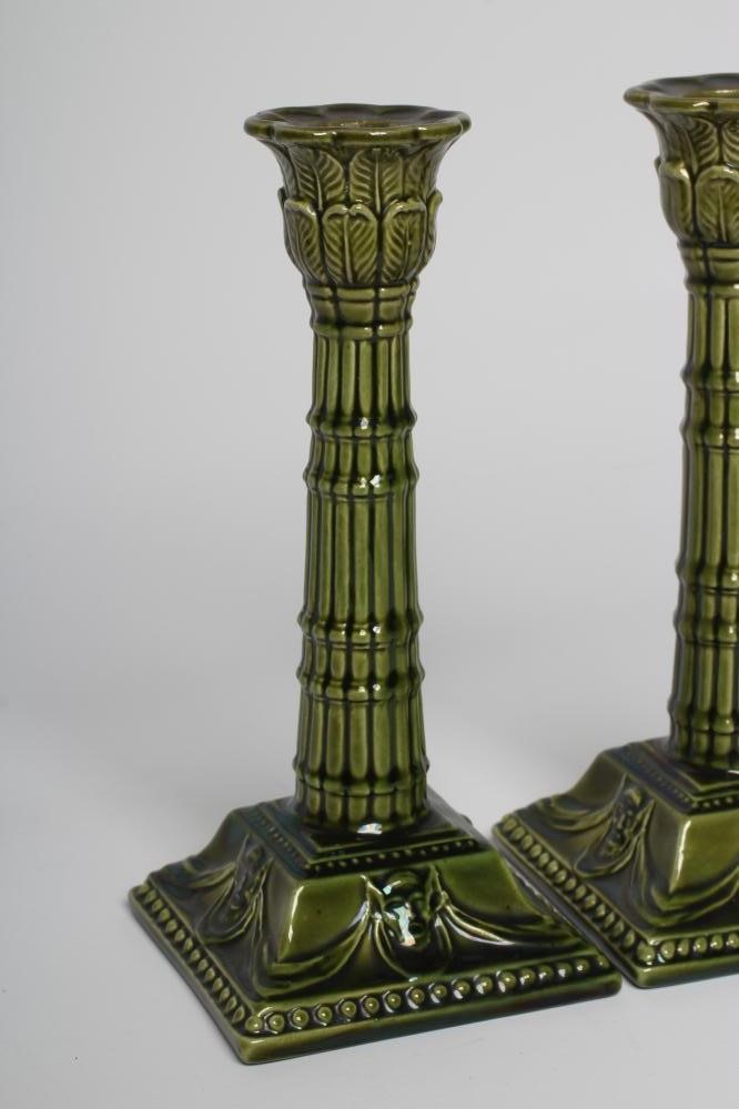A PAIR OF BURMANTOFTS FAIENCE GREEN GLAZED CANDLESTICKS Image