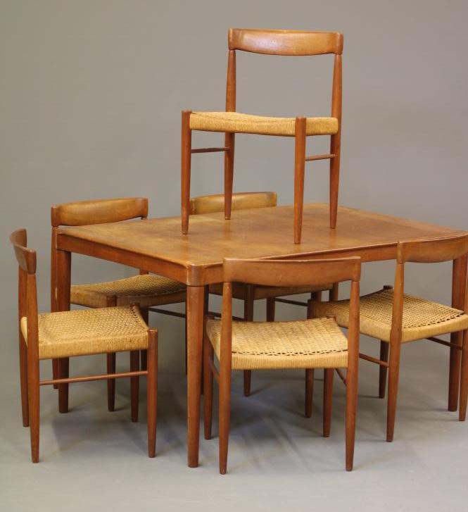 A BRAMIN TEAK DINING TABLE AND CHAIRS Image