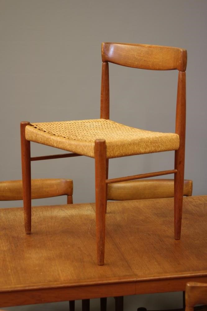 A BRAMIN TEAK DINING TABLE AND CHAIRS Image