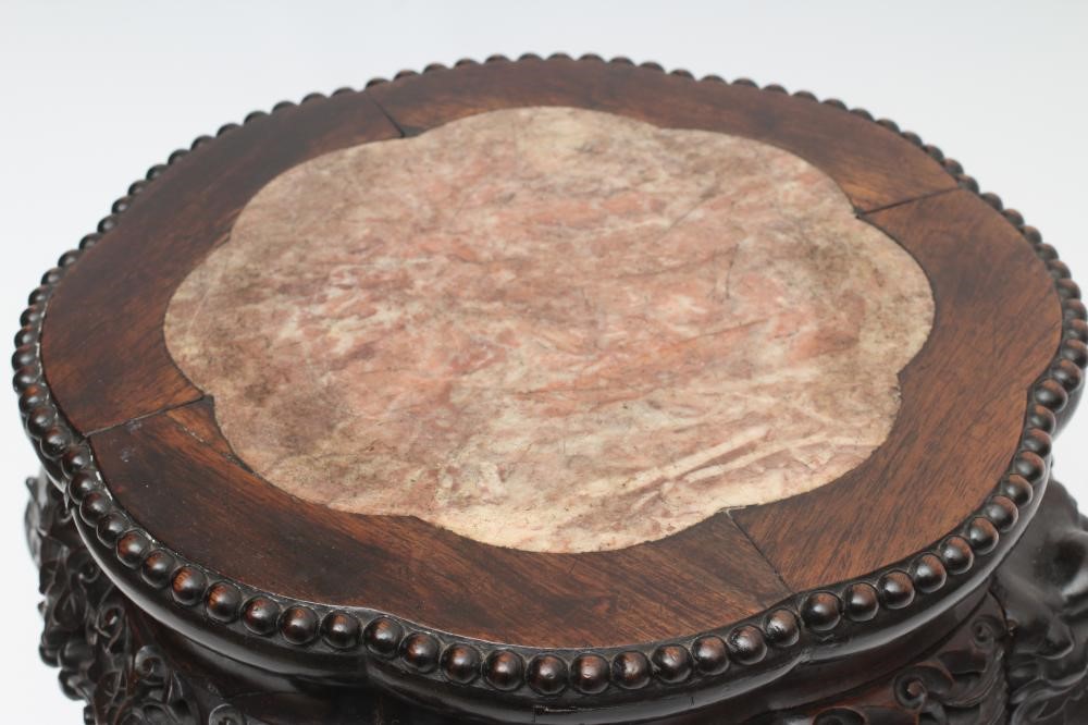 A CHINESE PADOUK WOOD JARDINIERE STAND Image