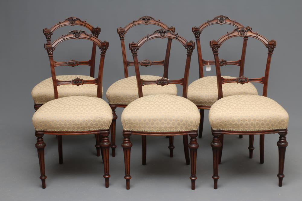 A SET OF SIX VICTORIAN WALNUT DINING CHAIRS upholstered in a cream and rust weave Image