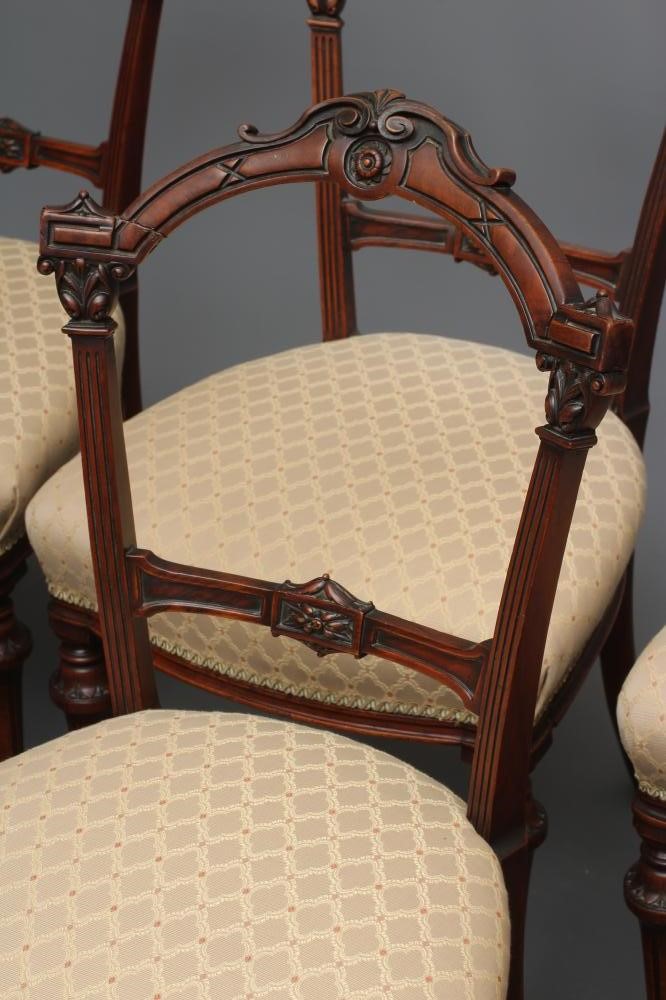 A SET OF SIX VICTORIAN WALNUT DINING CHAIRS upholstered in a cream and rust weave Image