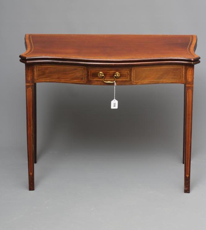 A GEORGIAN MAHOGANY SERPENTINE FOLDING CARD TABLE Image