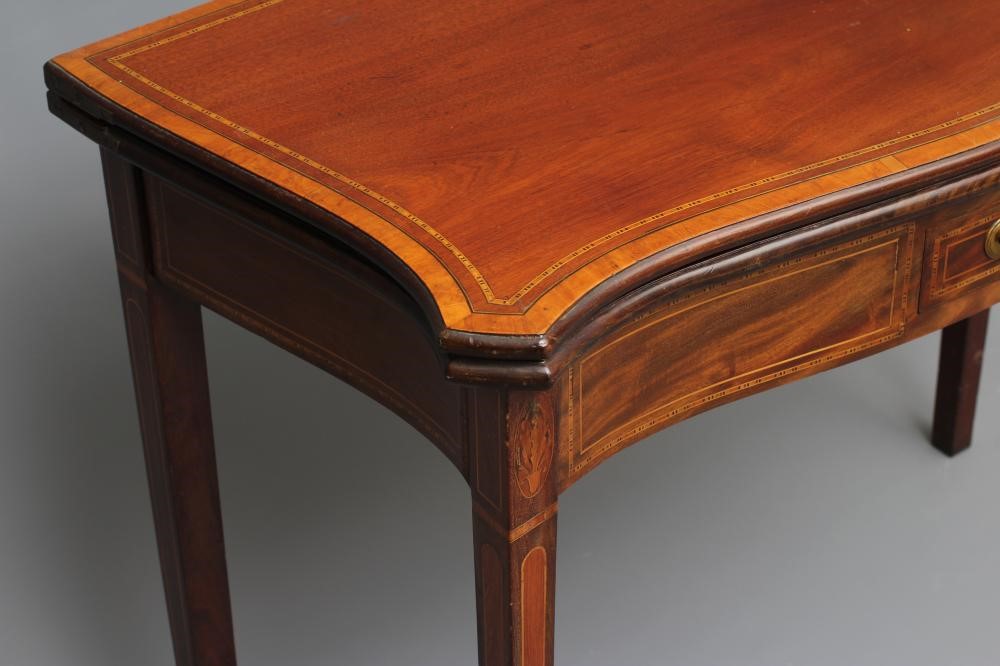 A GEORGIAN MAHOGANY SERPENTINE FOLDING CARD TABLE Image