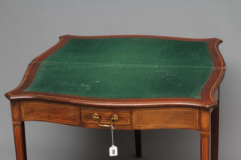 A GEORGIAN MAHOGANY SERPENTINE FOLDING CARD TABLE Image
