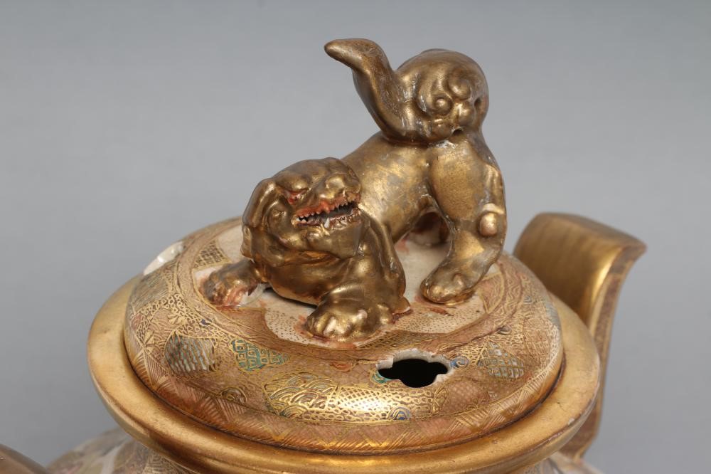 A SATSUMA EARTHENWARE KORO AND COVER of squat baluster form with two solid angular handles on four Image