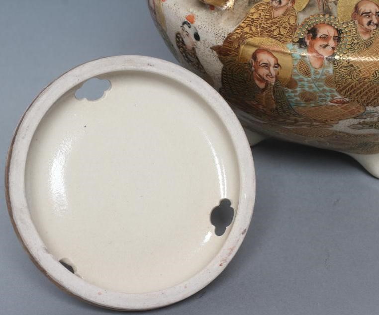 A SATSUMA EARTHENWARE KORO AND COVER of squat baluster form with two solid angular handles on four Image