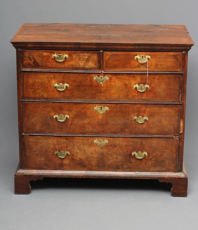 A WALNUT AND FEATHER BANDED STRAIGHT FRONTED CHEST Image